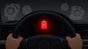 Car dashboard with battery warning light.
