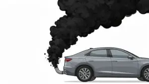 Car emitting thick black exhaust smoke.
