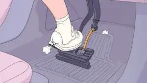 Foot using pedal pump in car interior