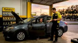 Technician provides walk-in oil change service