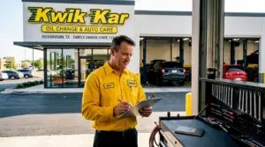 Auto technician outside Richardson repair shop