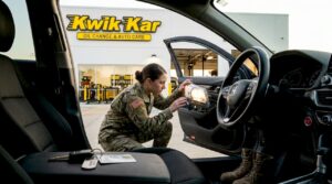 Military member checking car at inspection station