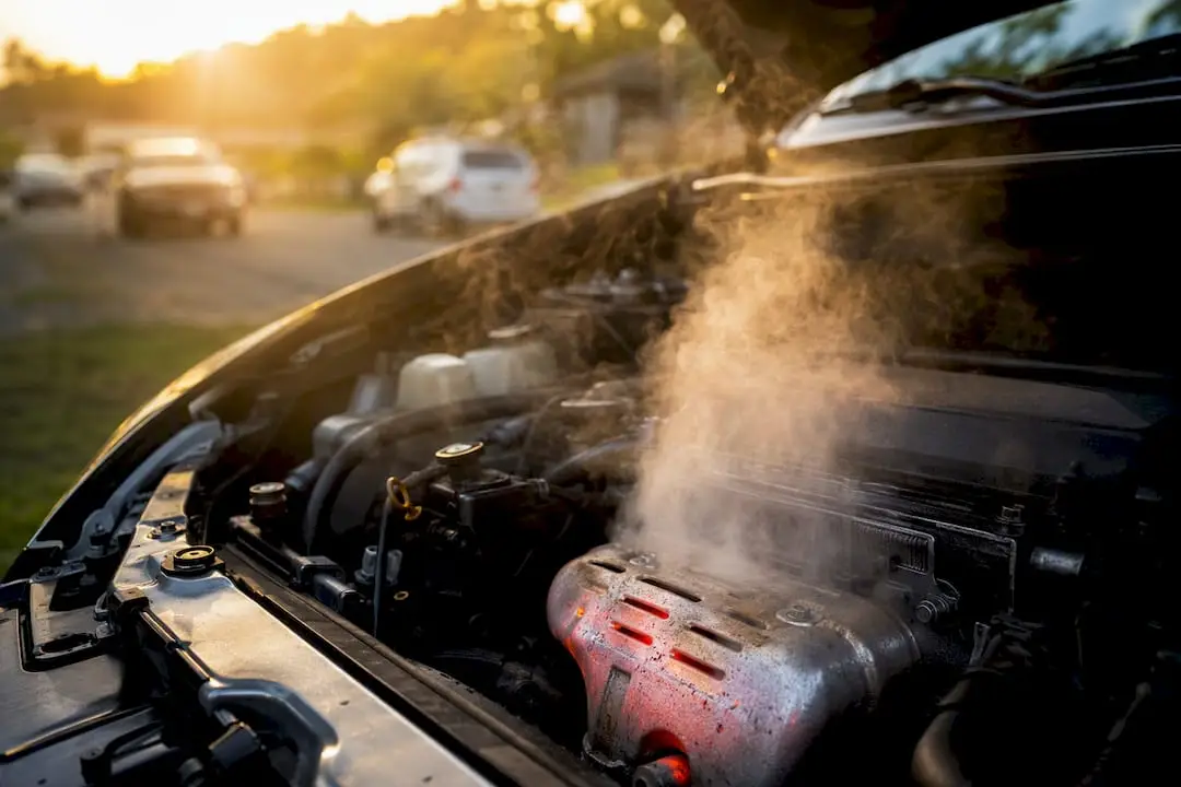 Engine hood open with steam from exhaust area