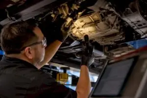 Technician inspecting an anonymous transmission housing